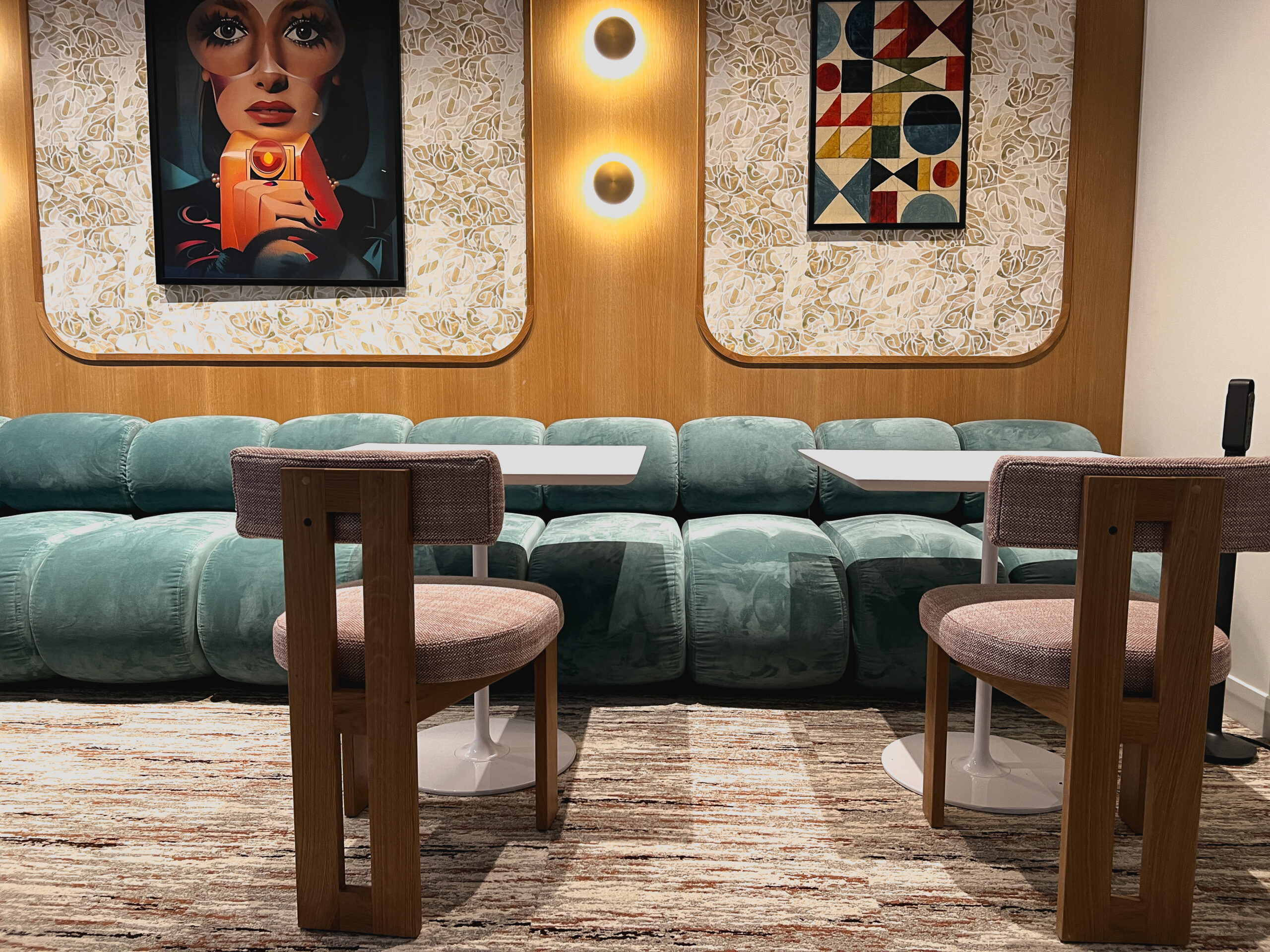 Banquette seating with artwork at Convene 360 Madison
