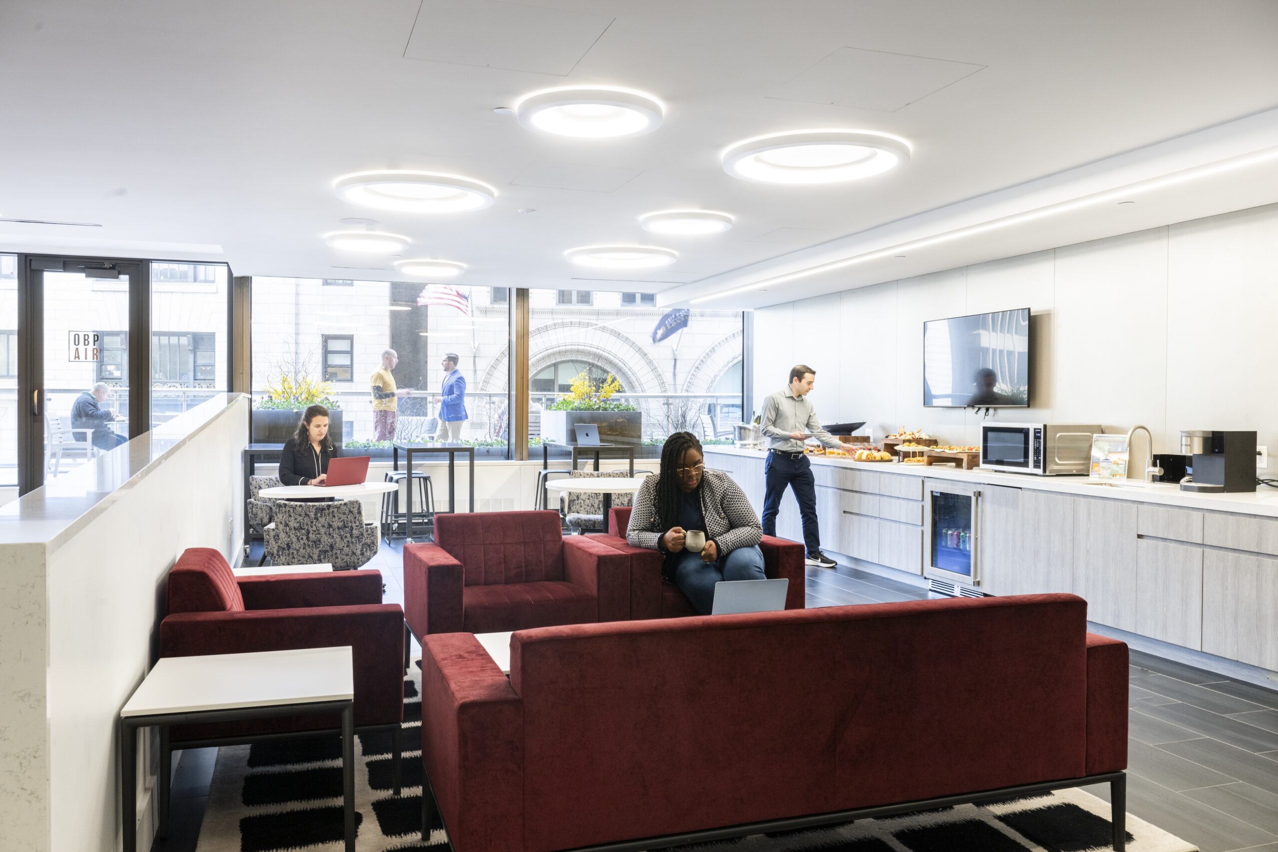People in dining lounge Convene One Boston Place