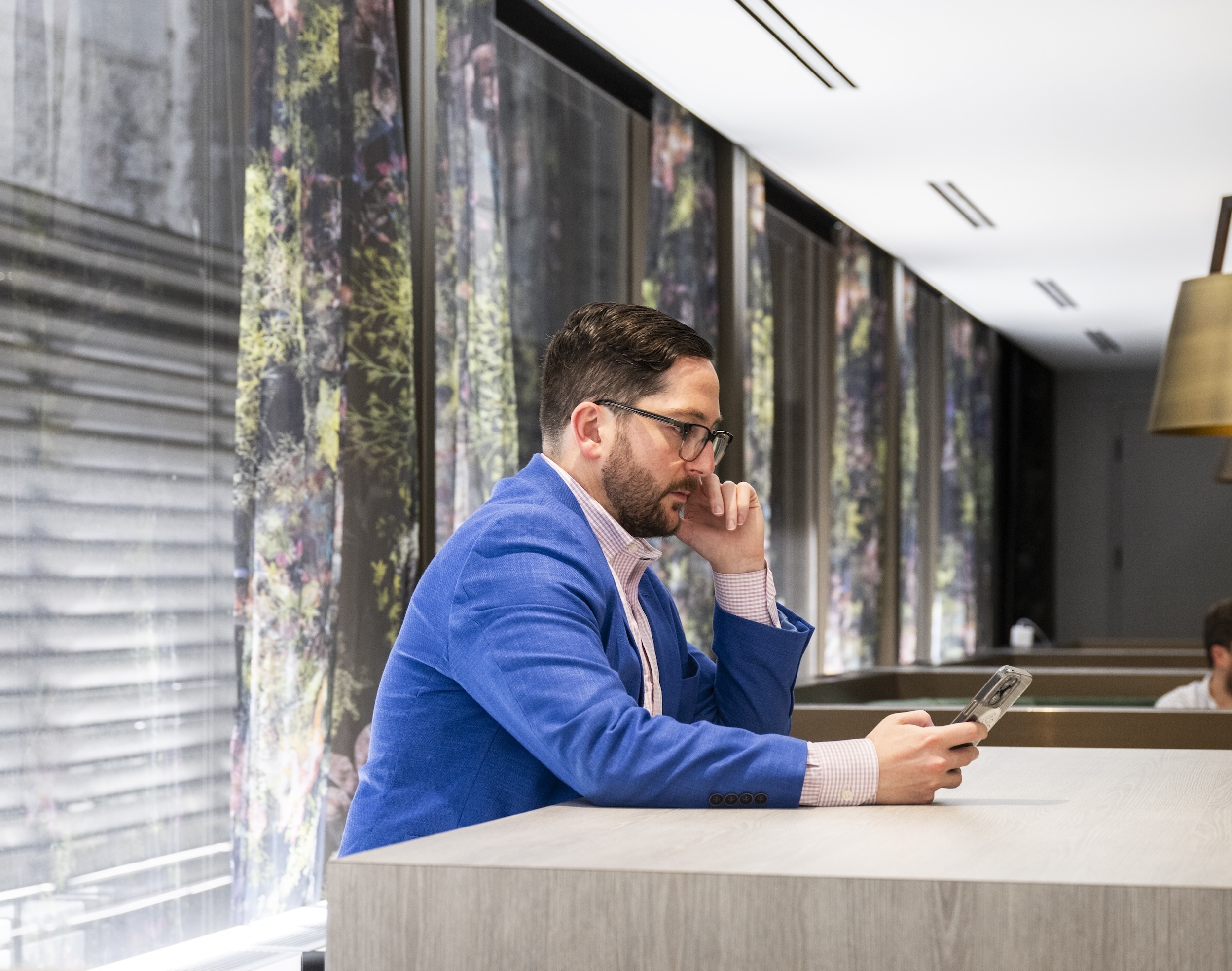 Man on phone at Convene One Boston Place