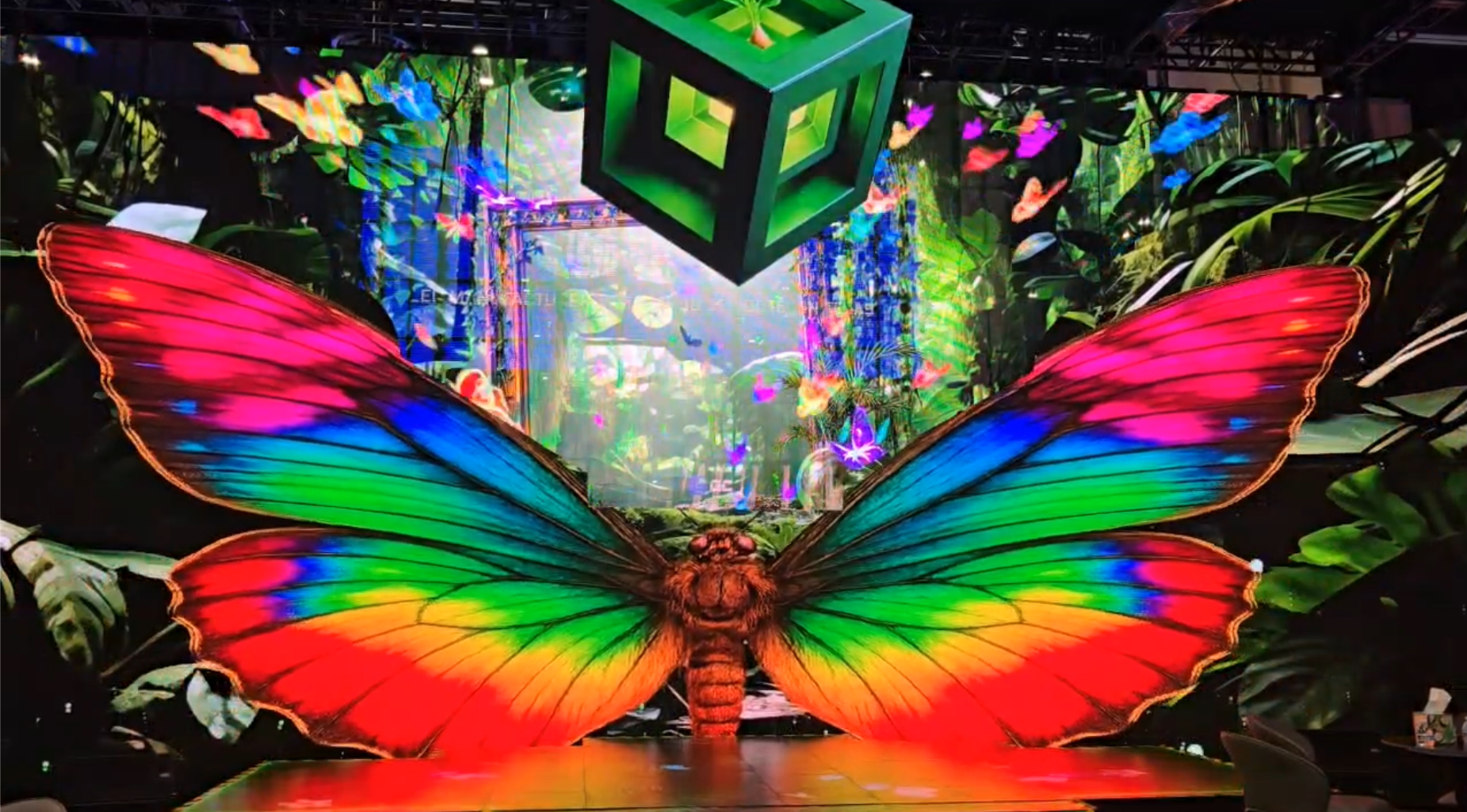 Massive rainbow colored butterfly on screen
