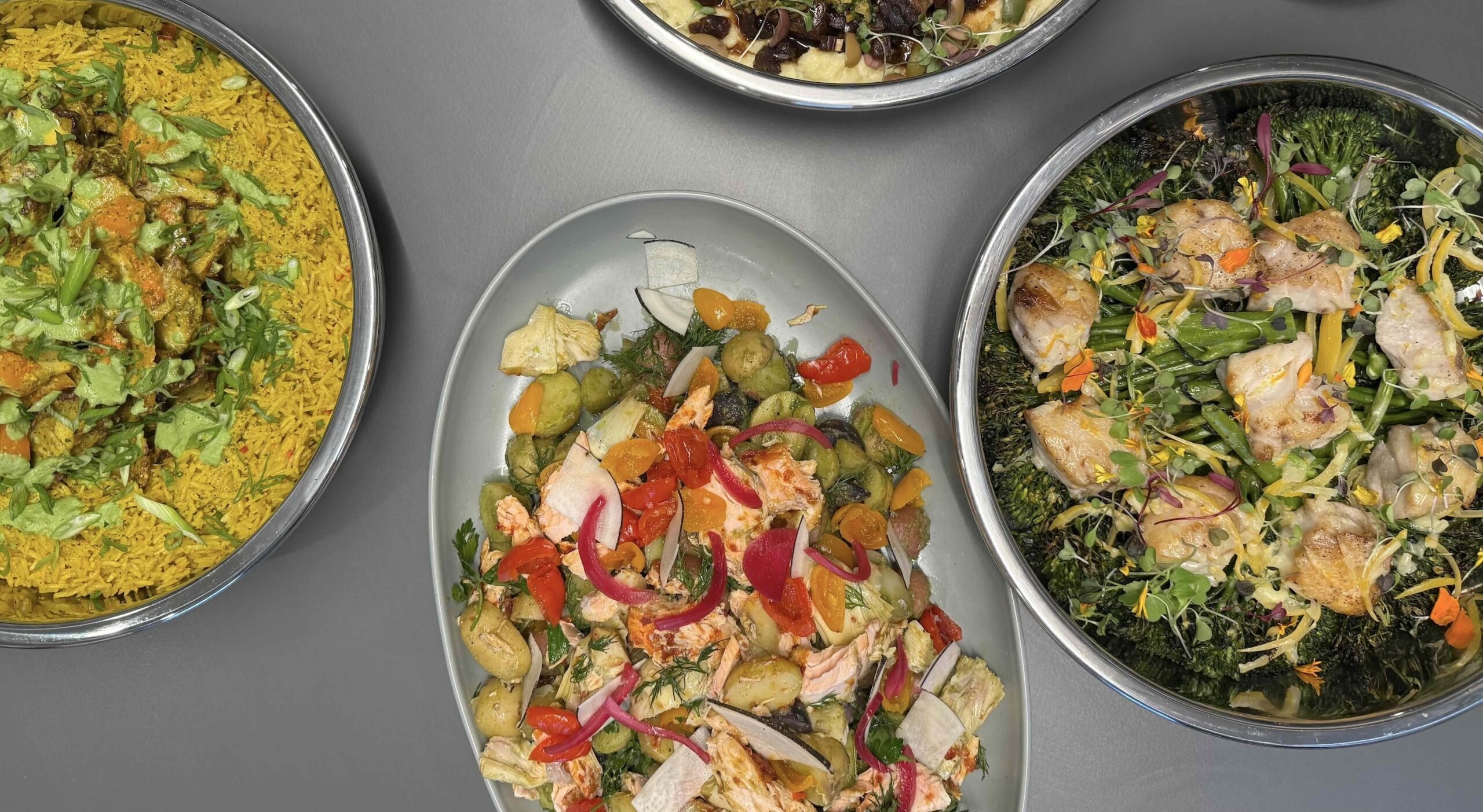 Convene entrees and salads in platters with colorful garnish and winter vegetables.