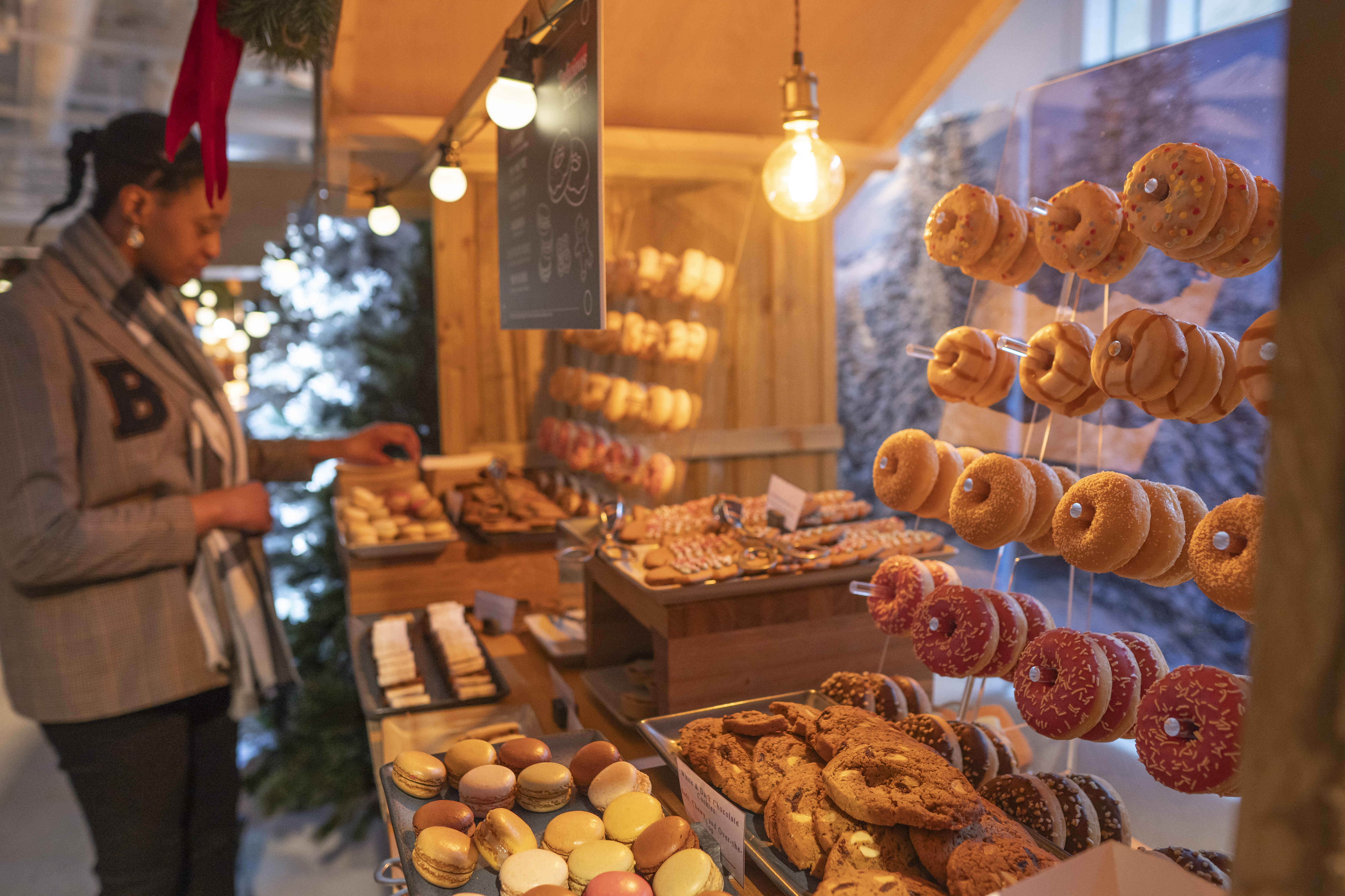 Person getting donuts from a display